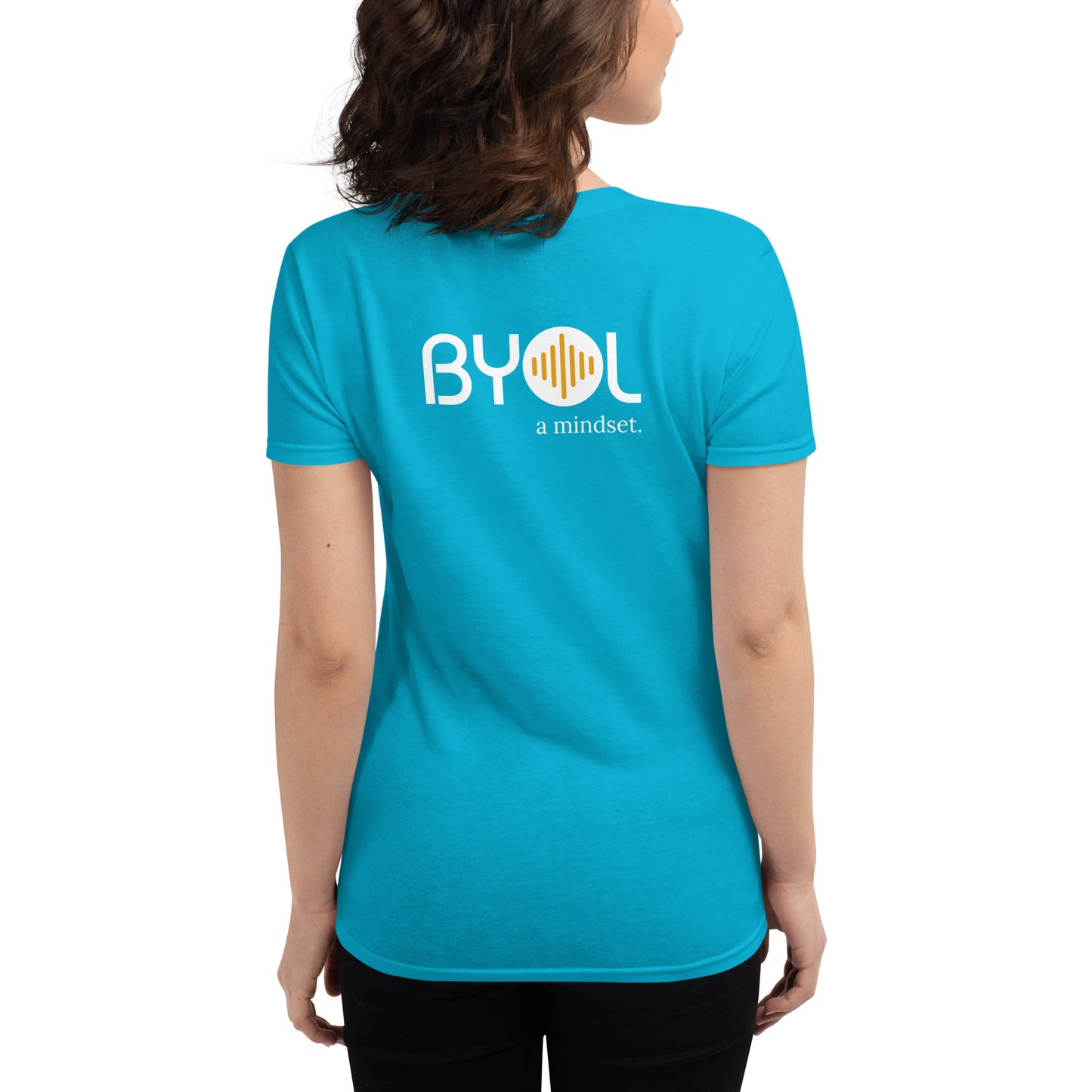 Back view of a woman wearing a carribean blue BYOL mindset t-shirt with color options in black, red, blue, gray, and white, available in sizes S to 3XL.