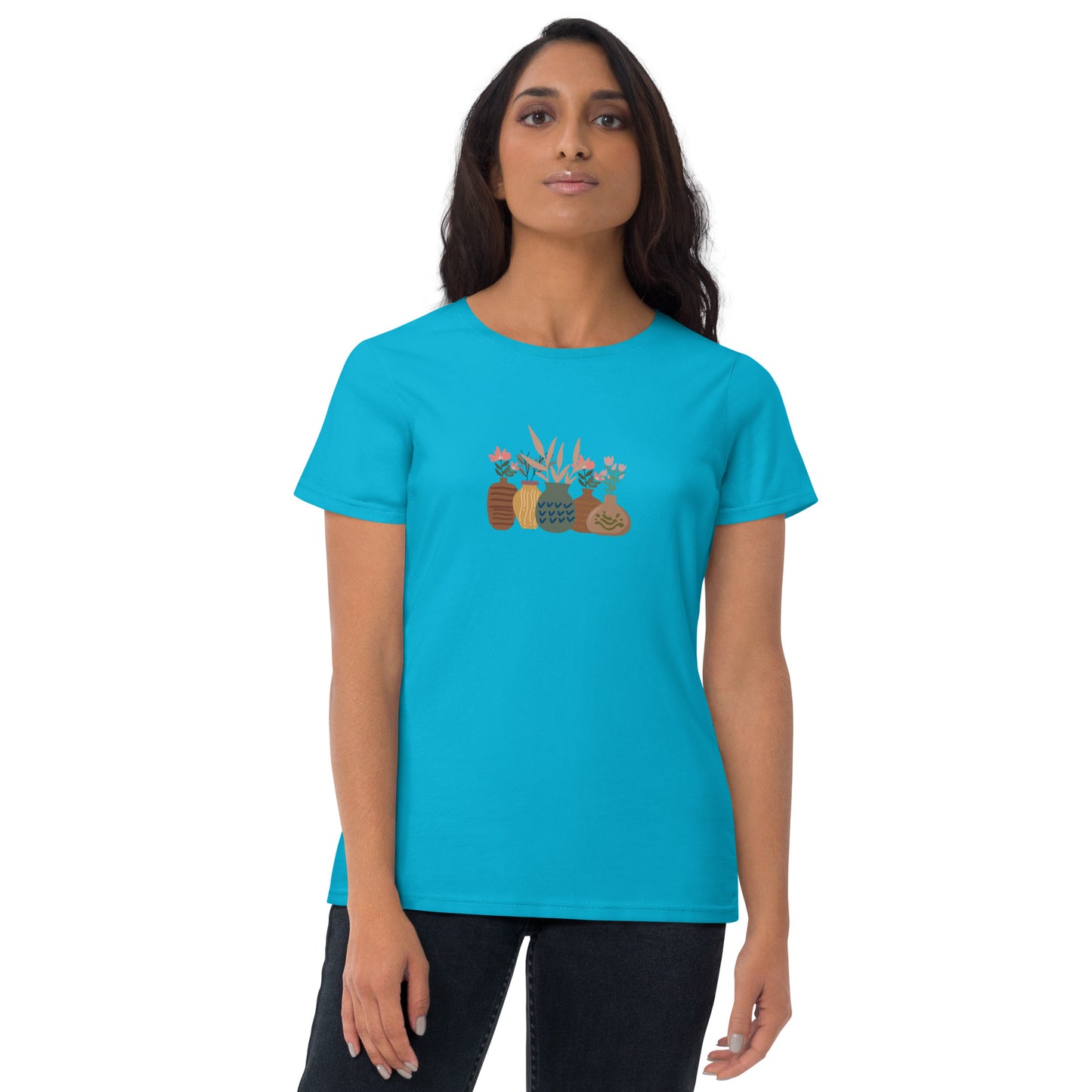 Woman wearing a Caribbean blue fitted tee with a charming potted plants design, embodying subtle self-expression and nature-inspired style by BYOL.