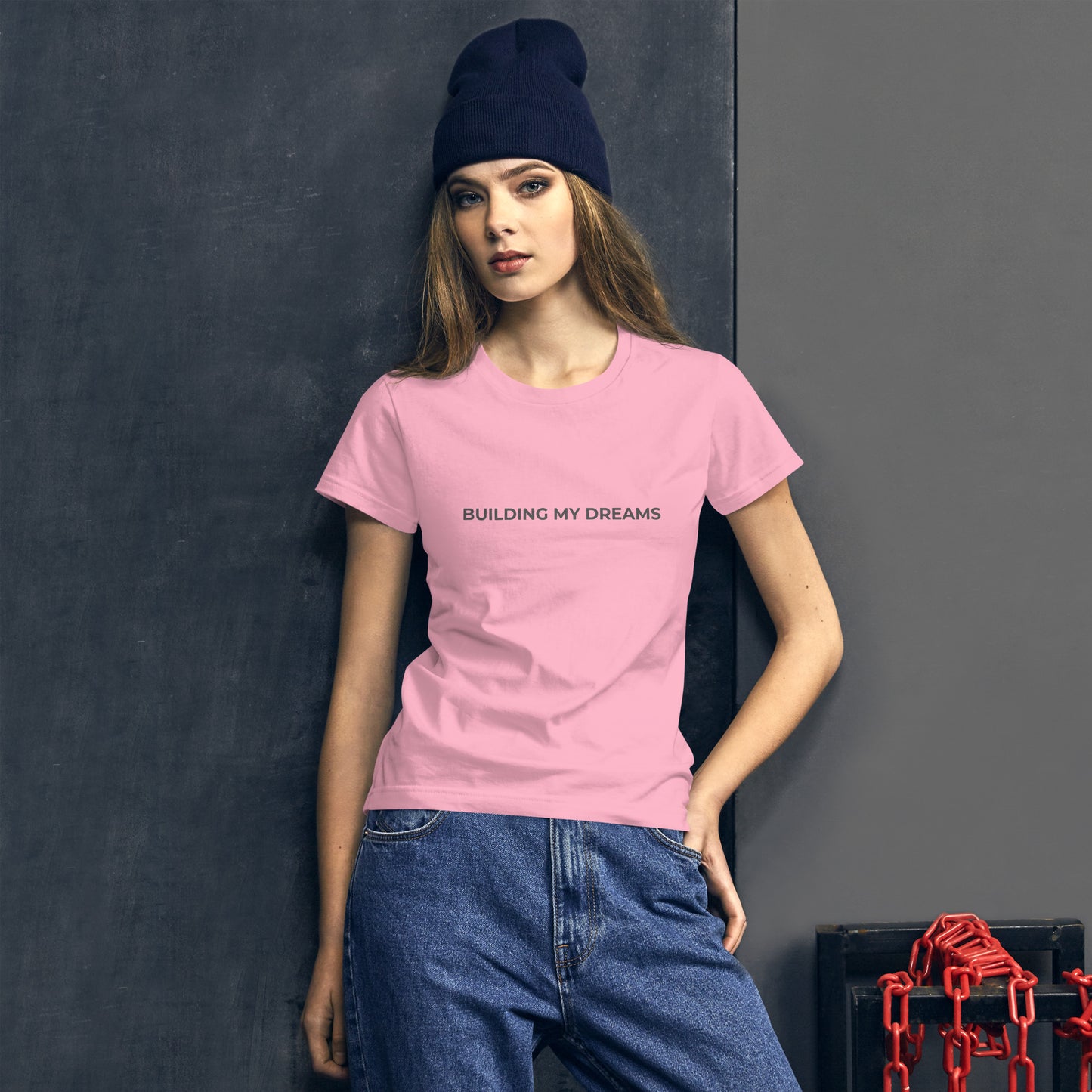 Women’s fitted pink tee with the text "Building My Dreams".