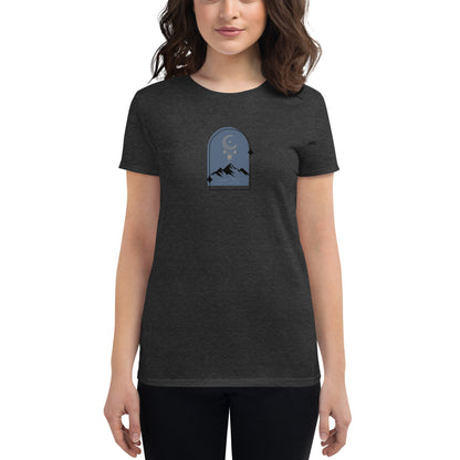 Woman wearing a dark heather grey fitted tee with a moonlit mountain design, showcasing serene and comfortable fashion by BYOL.