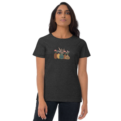 Woman wearing a dark Heather grey fitted tee with a charming potted plants design, embodying subtle self-expression and nature-inspired style by BYOL.