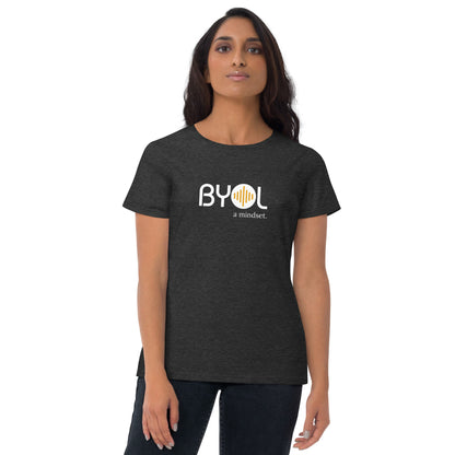 Woman wearing a dark heather grey BYOL mindset t-shirt with color options in black, red, blue, gray, and white, available in sizes S to 3XL.