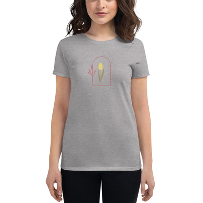 Woman wearing a athletic grey fitted tee with a delicate tulip arch design, showcasing subtle elegance and nature-inspired style by BYOL.