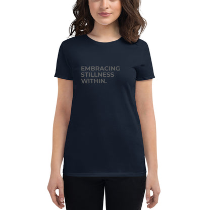 Women’s fitted navy tee with the text "Embracing Stillness Within".