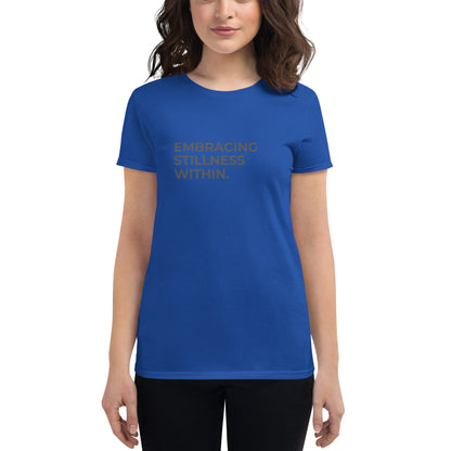 Women’s fitted blue tee with the text "Embracing Stillness Within".