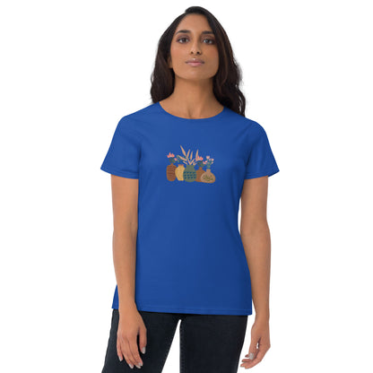 Woman wearing a royal blue fitted tee with a charming potted plants design, embodying subtle self-expression and nature-inspired style by BYOL.