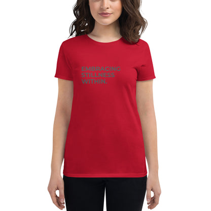 Women’s fitted red tee with the text "Embracing Stillness Within".