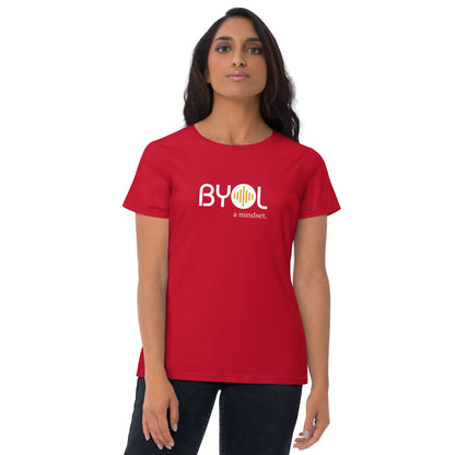 Woman wearing a red BYOL mindset t-shirt with color options in black, red, blue, gray, and white, available in sizes S to 3XL.