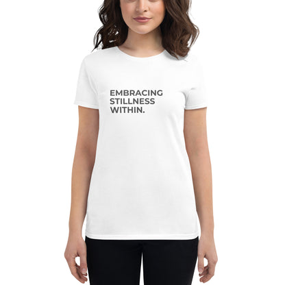 Women’s fitted white tee with the text "Embracing Stillness Within".