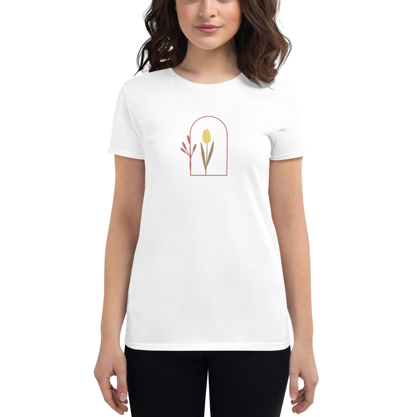 Woman wearing a white fitted tee with a delicate tulip arch design, showcasing subtle elegance and nature-inspired style by BYOL.