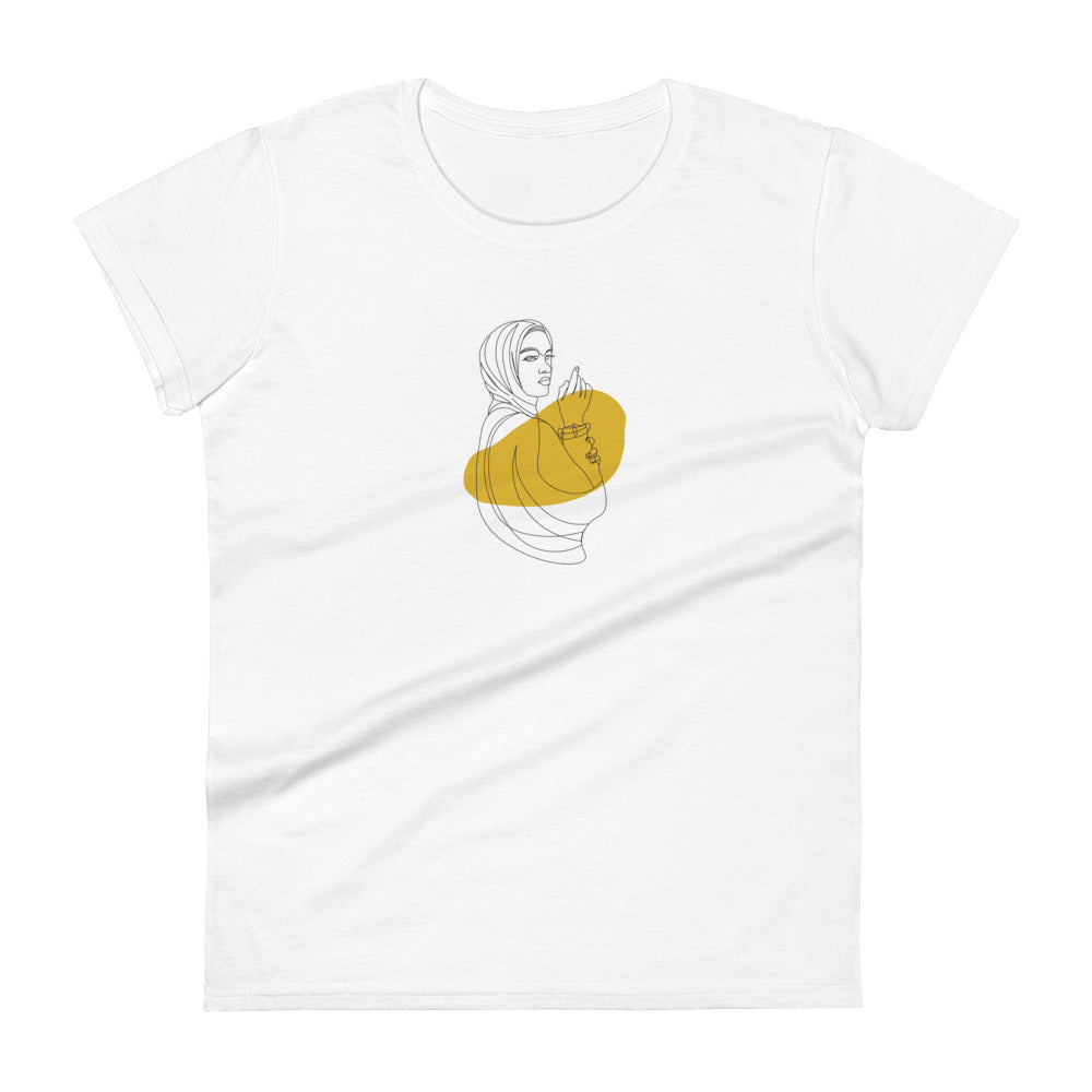 Woman wearing a white fitted tee with an empowered silhouette design in yellow, showcasing subtle yet impactful self-expression by BYOL.