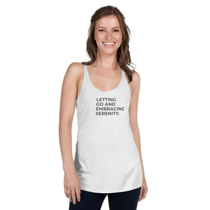 Woman in a heather white racer back tank with "Letting Go and Embracing Serenity" text.