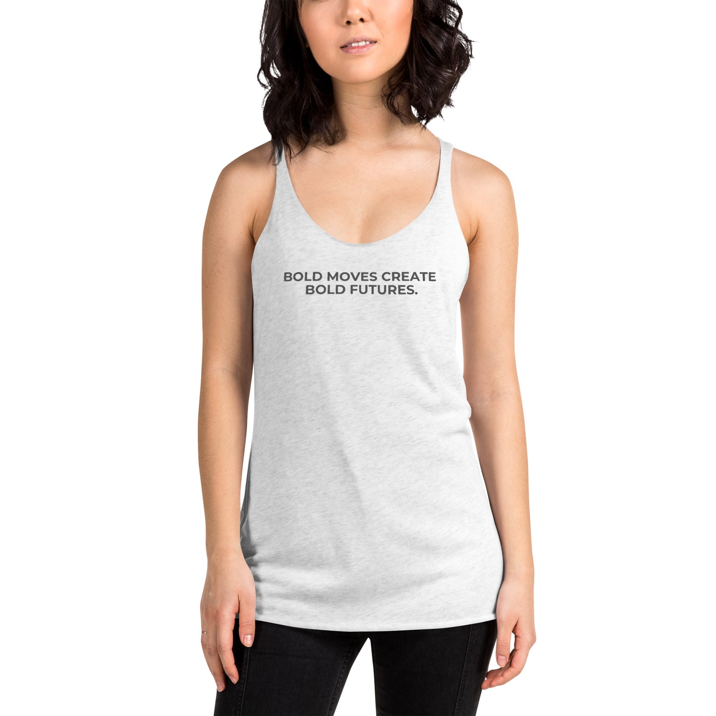 Woman wearing a heather white racer back tank with "Bold Moves Create Bold Futures" text.