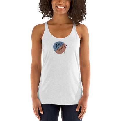 Woman wearing a heather white racer back tank top with a subtle design of a person gazing at the moon.