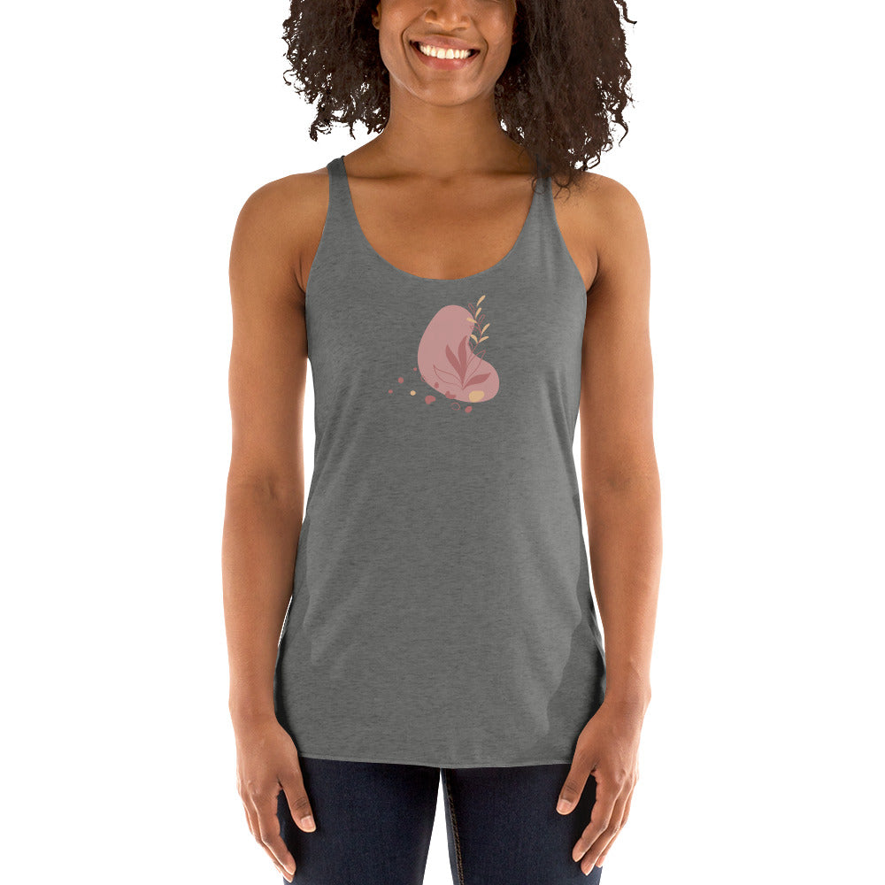 Woman wearing a heather grey racer back tank top with a subtle heart-shaped leaf design. 