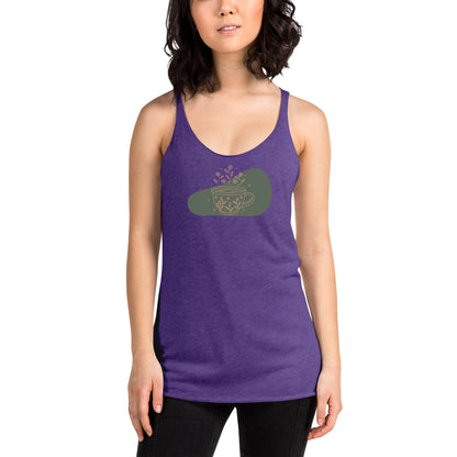 Woman wearing a heather purple racer back tank top with a muted coffee cup and floral design.