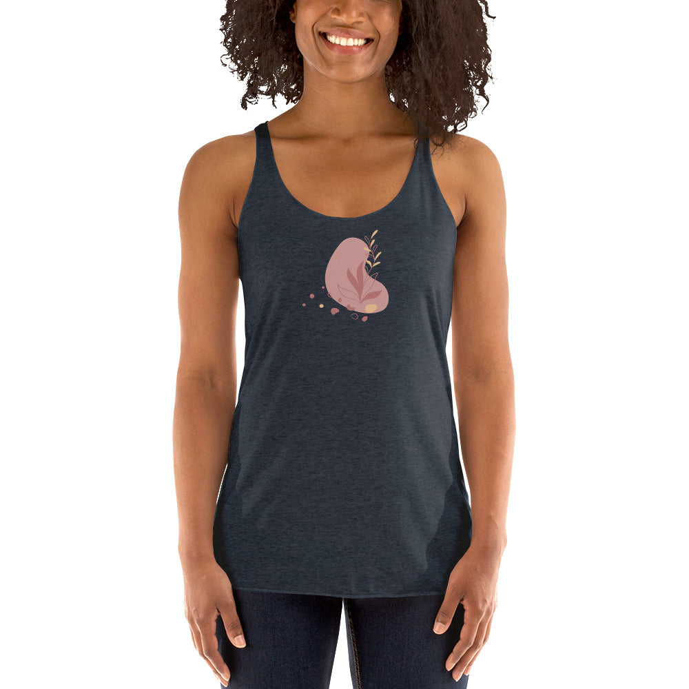 Woman wearing a heather indigo racer back tank top with a subtle heart-shaped leaf design. 