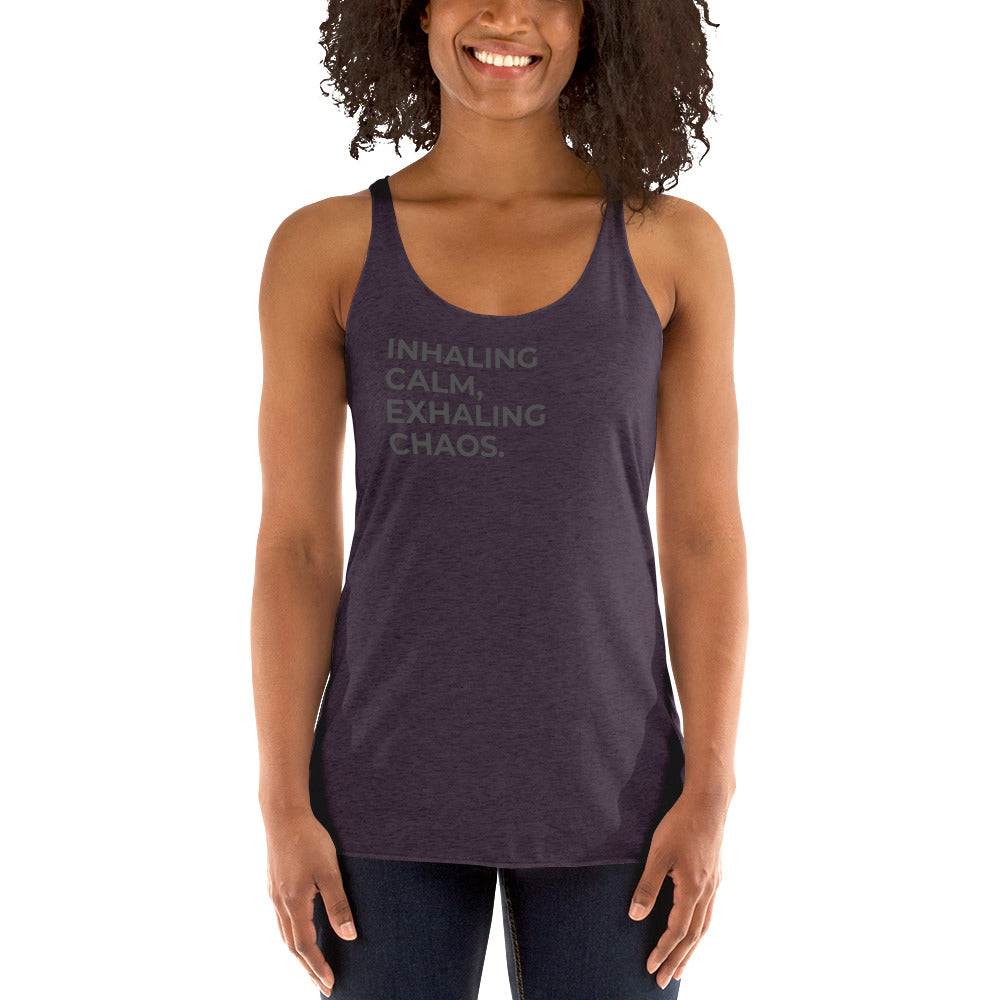 Smiling woman in a vintage purple racer back tank with "Inhaling Calm, Exhaling Chaos" text.