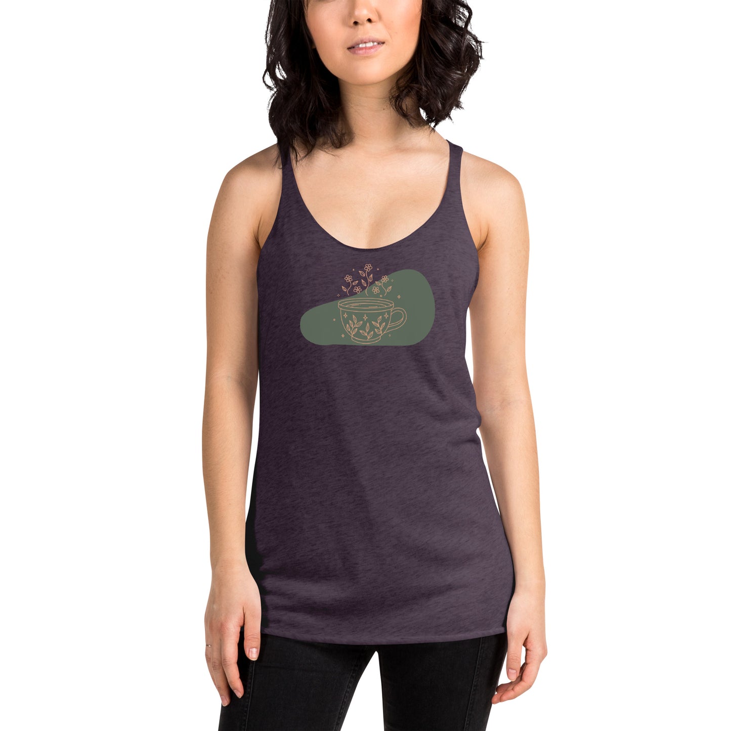 Woman wearing a heather purple racer back tank top with a muted coffee cup and floral design.