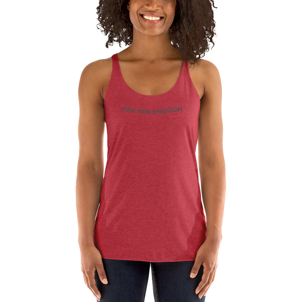 Smiling woman wearing a vintage red racer back tank with "You Are Enough" text.