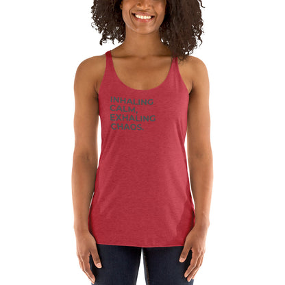 Smiling woman in a vintage grey racer back tank with "Inhaling Calm, Exhaling Chaos" text.