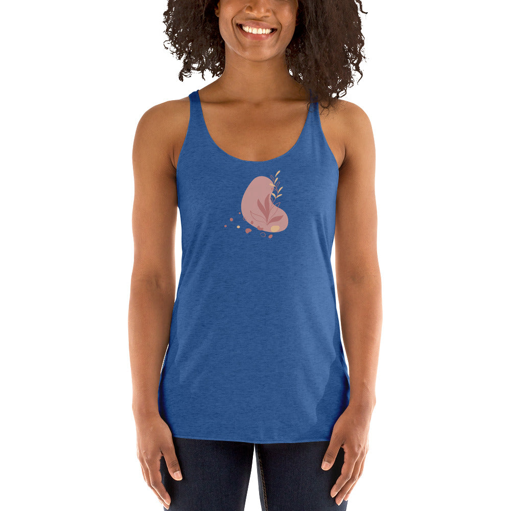 Woman wearing a heather blue racer back tank top with a subtle heart-shaped leaf design. 