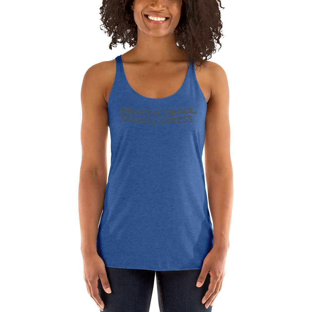 Smiling woman in a vintage royal racer back tank with "Breathe Peace, Exhale Stress" text.