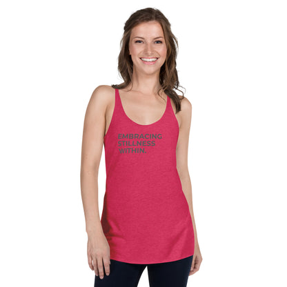 Smiling woman wearing a pink racer back tank with "Embracing Stillness Within" text.