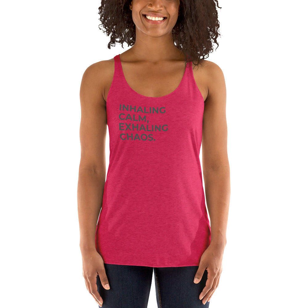 Smiling woman in a pink  racer back tank with "Inhaling Calm, Exhaling Chaos" text.