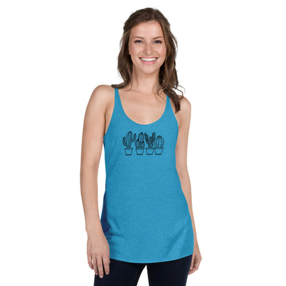 Woman wearing a heather blue racer back tank top with a subtle cactus design.