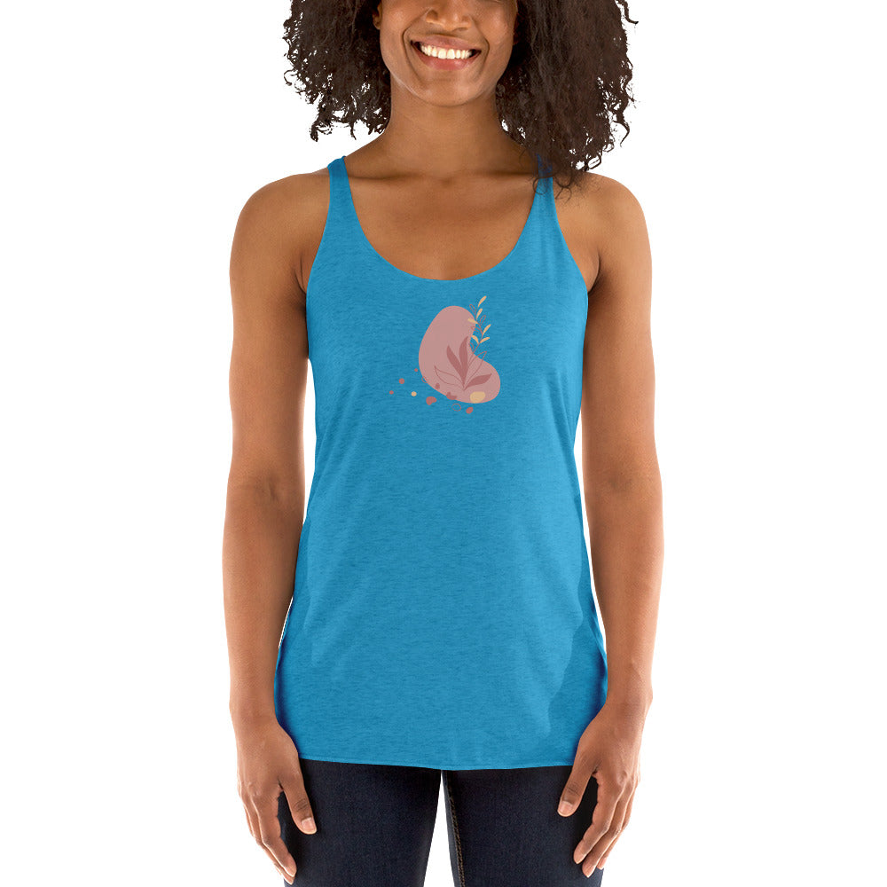 Woman wearing a heather blue racer back tank top with a subtle heart-shaped leaf design. 