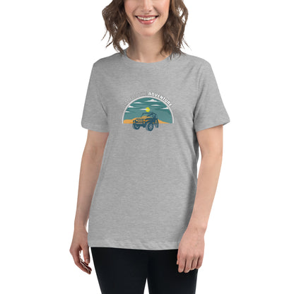 Woman smiling in a athletic heather grey relaxed t-shirt with 'Aim for the Adventure' and a vintage camper graphic