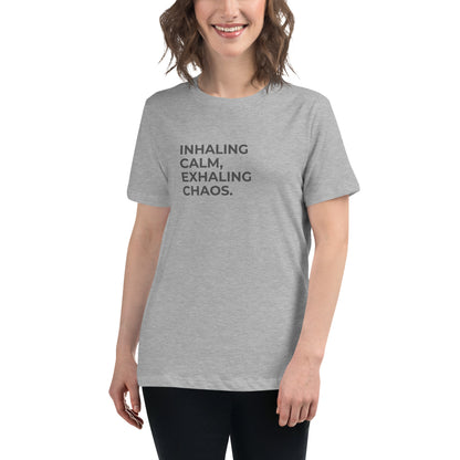 Woman wearing a athletic grey relaxed tee with "Inhaling Calm, Exhaling Chaos" printed.