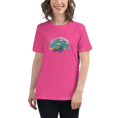 Woman smiling in a berry relaxed t-shirt with 'Aim for the Adventure' and a vintage camper graphic