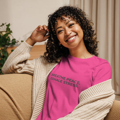 Woman wearing a berry relaxed tee with "Breathe Peace, Exhale Stress" printed.