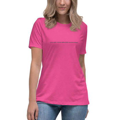 Woman wearing a berry relaxed tee with "You Are Your Greatest Investment" printed.