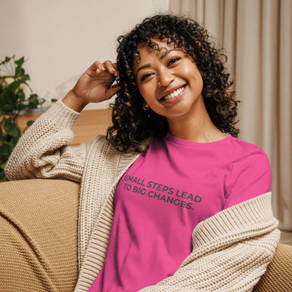 Woman wearing an berry relaxed tee with "Small Steps Lead to Big Changes" printed.