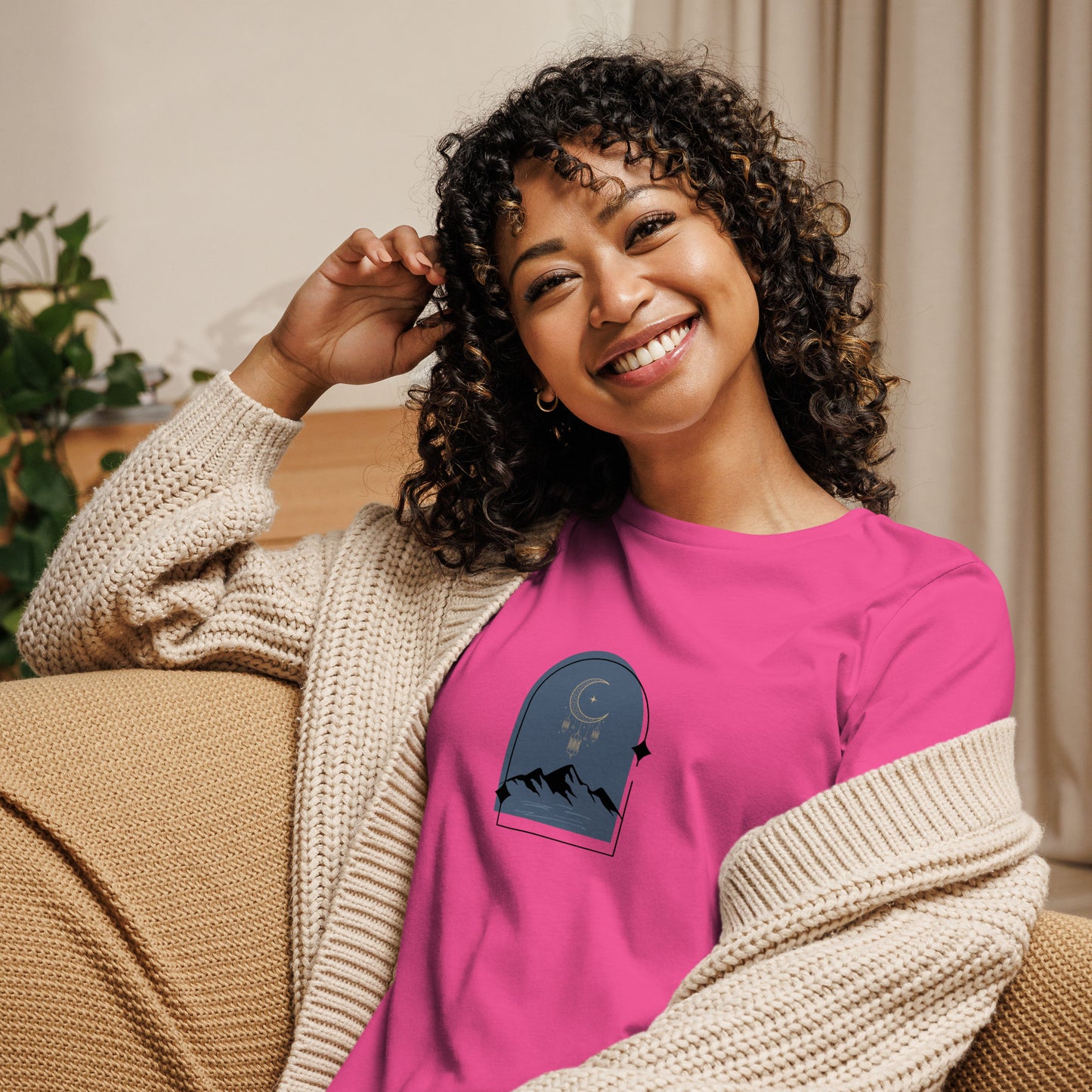 Woman wearing a berry relaxed tee with a tranquil night sky graphic design, representing comfortable and authentic fashion by BYOL.