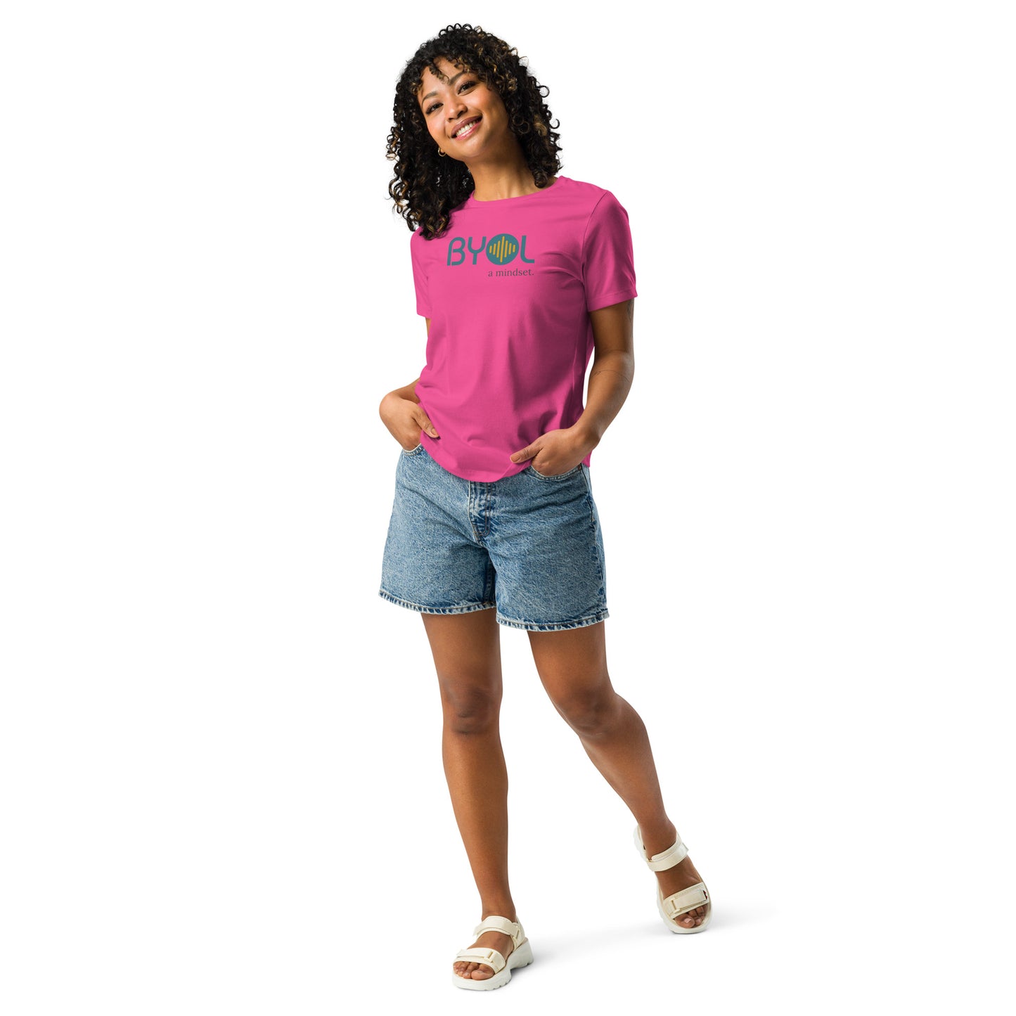 Woman wearing a berry relaxed fit BYOL mindset t-shirt with color options in black, pink, blue, and gray, available in sizes S to 3XL.