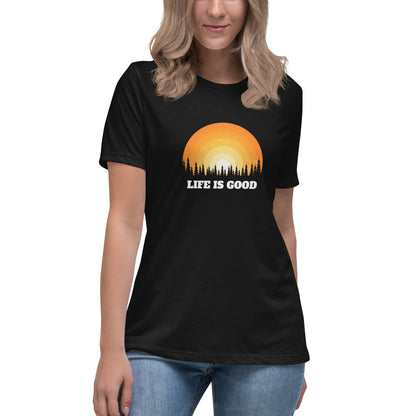 Woman in black relaxed t-shirt with 'Life Is Good' sunset graphic