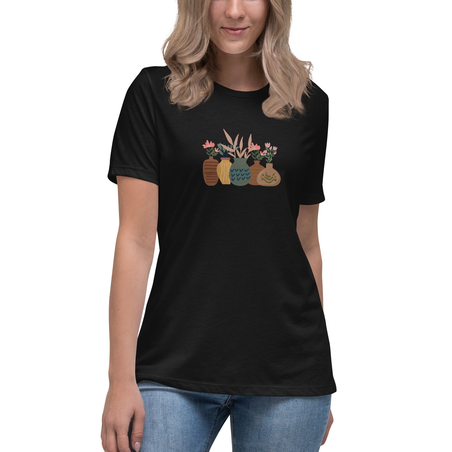 Woman wearing a black relaxed tee with a charming vase floral graphic design, embodying comfortable and authentic fashion by BYOL.