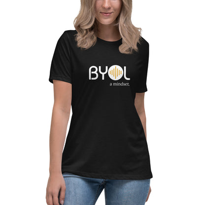 Woman wearing a black relaxed fit BYOL mindset t-shirt  with color options in black, pink, blue, and gray, available in sizes S to 3XL.