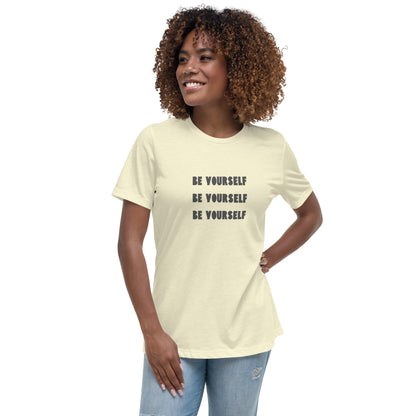 Smiling woman wearing a citron relaxed t-shirt with 'Be Yourself' text repeated