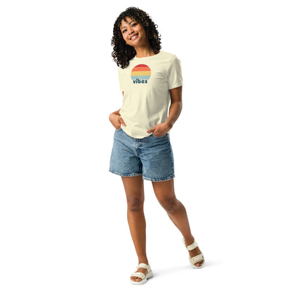 Woman wearing a citron relaxed t-shirt with retro 'good vibes' graphic