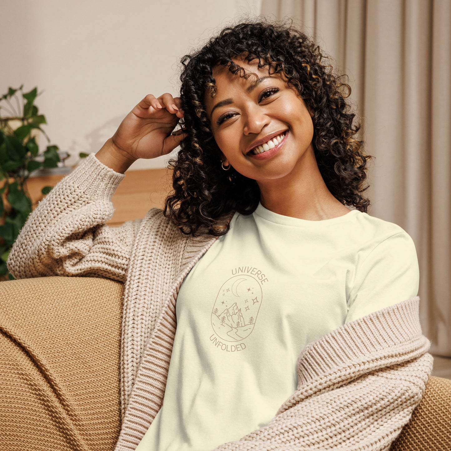 Woman smiling in a citron relaxed t-shirt with cosmic universe design