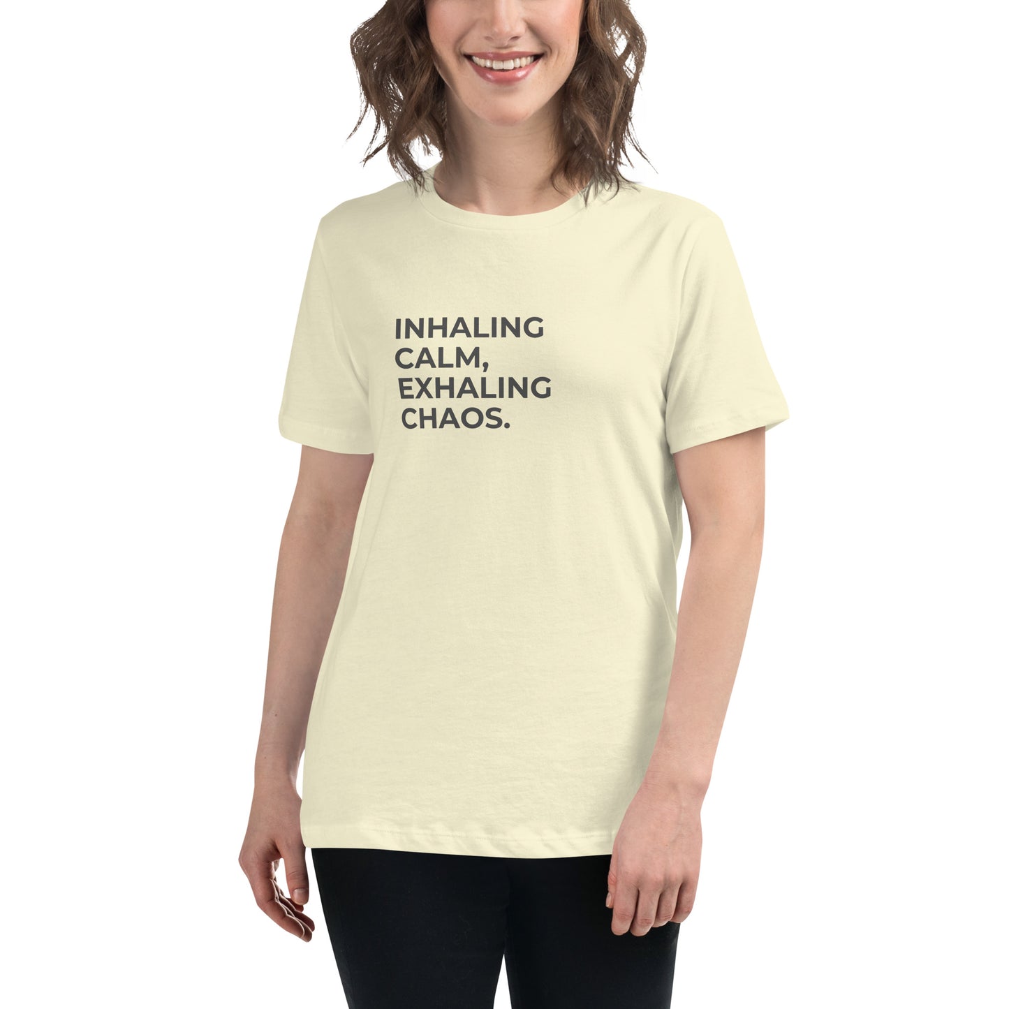 Woman wearing a citron relaxed tee with "Inhaling Calm, Exhaling Chaos" printed.