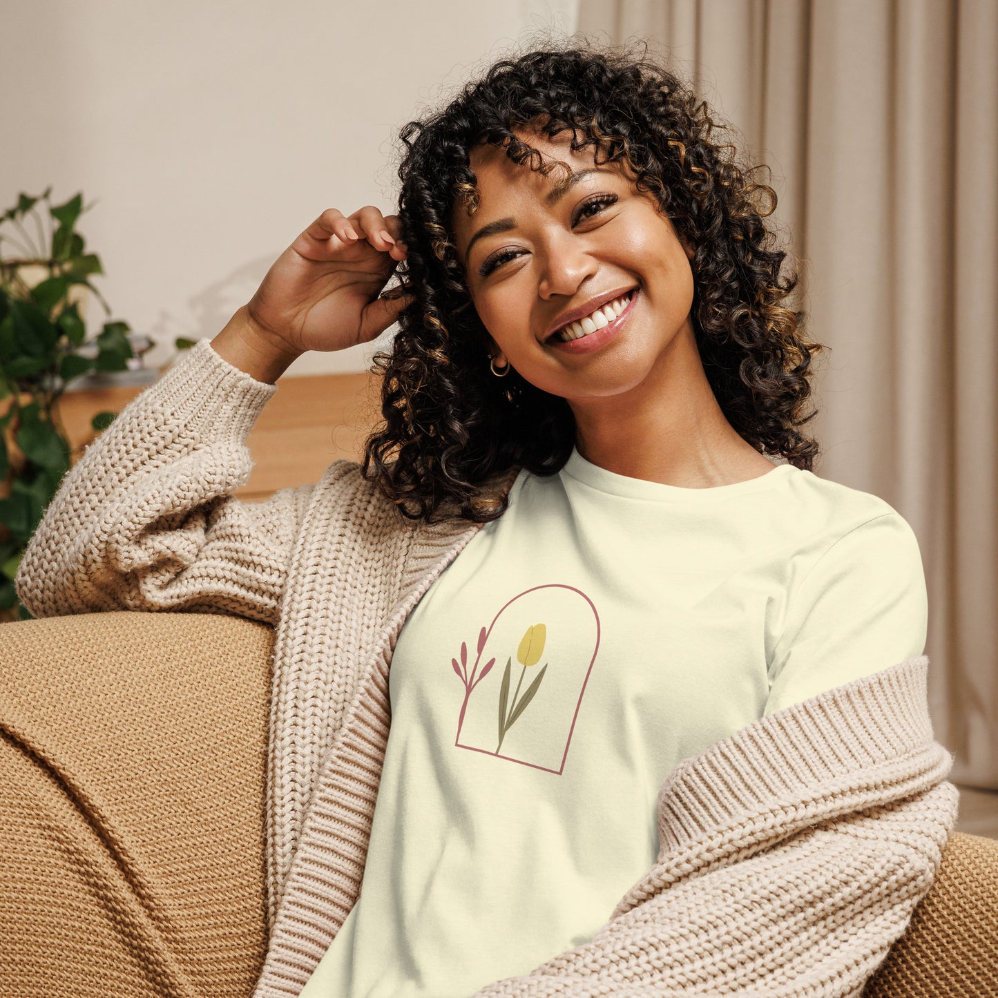 Woman wearing a citron relaxed tee with a minimalist tulip window graphic design, representing comfortable and authentic fashion by BYOL.