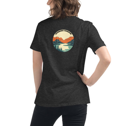 Woman wearing a heather grey relaxed t-shirt featuring a scenic mountain and lake design with 'Expanding Horizons' text