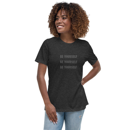 Smiling woman wearing a heather grey relaxed t-shirt with 'Be Yourself' text repeated