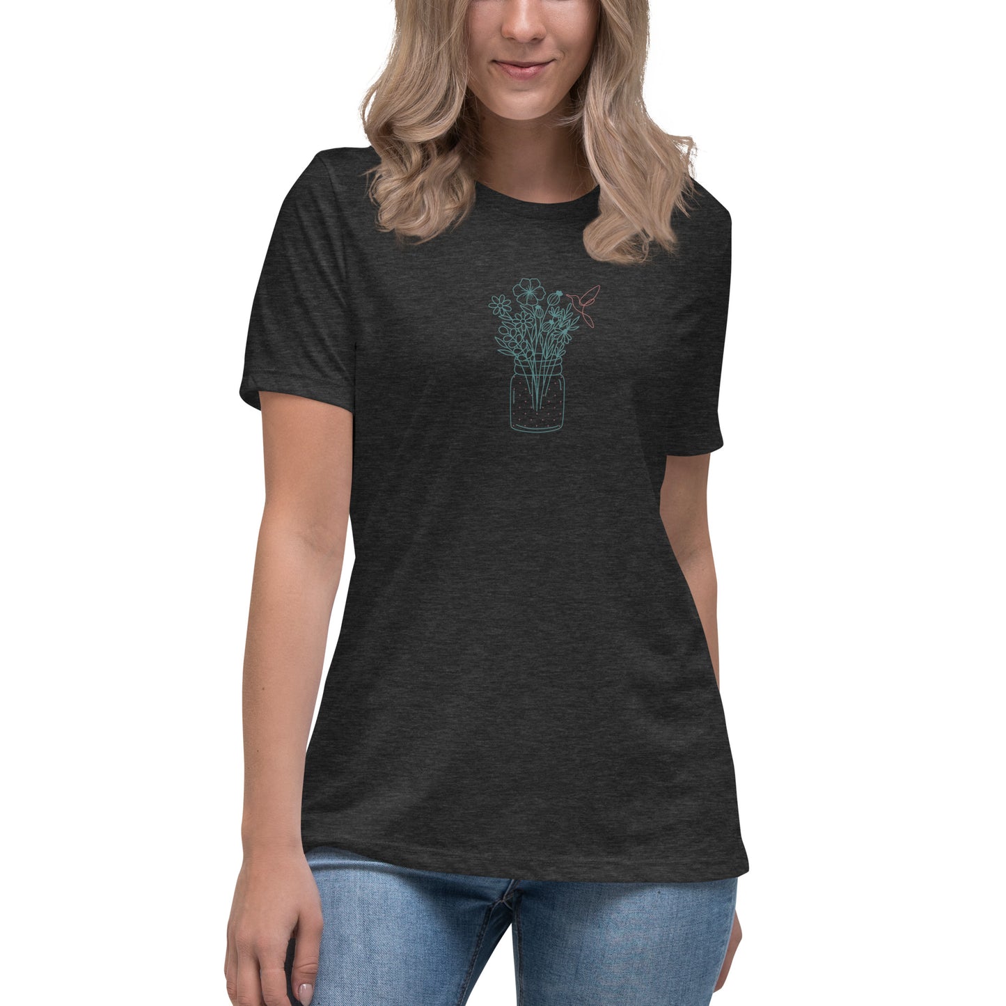 Woman wearing a dark athletic grey relaxed tee with a delicate floral jar graphic design, representing comfortable and authentic fashion by BYOL.